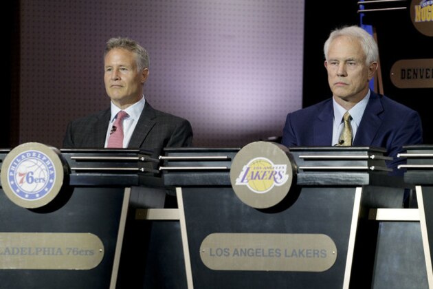 Philadelphia 76ers head coach Brett Brown, left, and Los Angeles Lakers general manager Mitch Kupchak listen as the results of the NBA basketball draft lottery are announced, Tuesday, May 17, 2016, in New York. (AP Photo/Julie Jacobson)