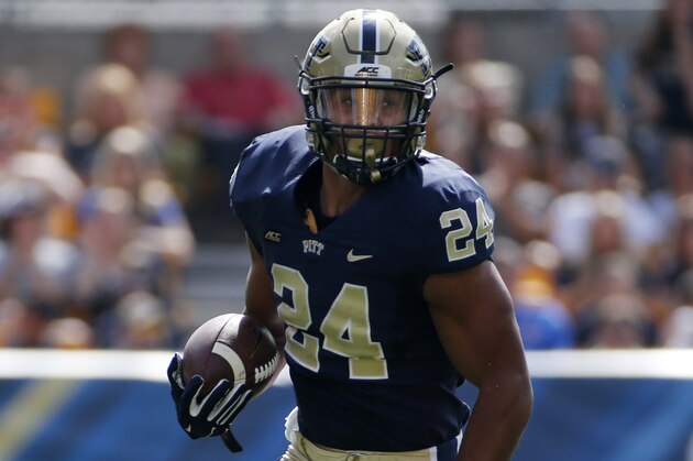 Pitt running back James Conner (24) rushes during a first-quarter in an NCAA college football game against Iowa in Pittsburgh Saturday, Sept. 20, 2014. Iowa won 24-20. (AP Photo/Gene Puskar)