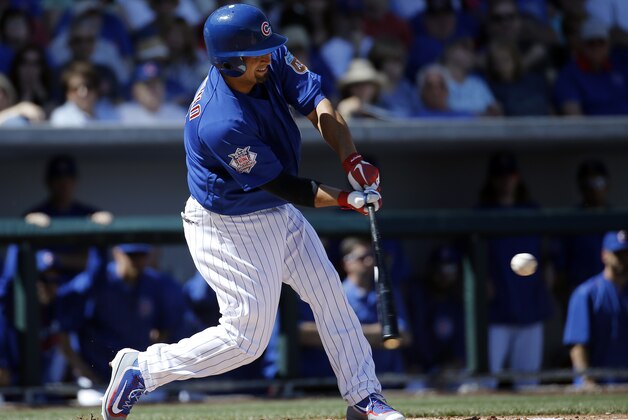 Chicago Cubs' Shane Victorino his a single during the second inning of a spring training baseball game against the Los Angeles Dodgers Tuesday, March 8, 2016, in Mesa, Ariz. (AP Photo/Morry Gash)
