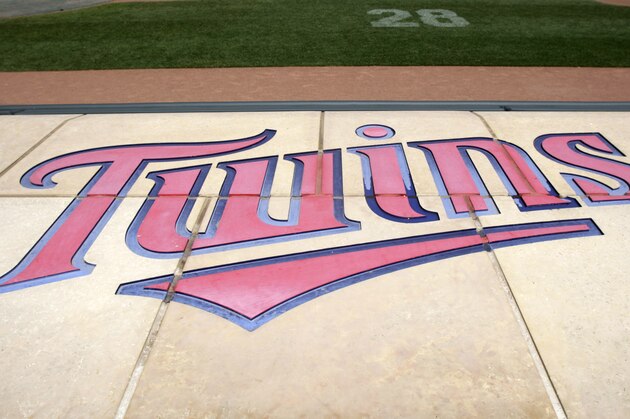 The Twins' logo is displayed on the Twins dugout at Target Field before a baseball game, between the Minnesota Twins and the Detroit Tigers, Sunday, July 24, 2011, in Minneapolis. (AP Photo/Paul Battaglia)