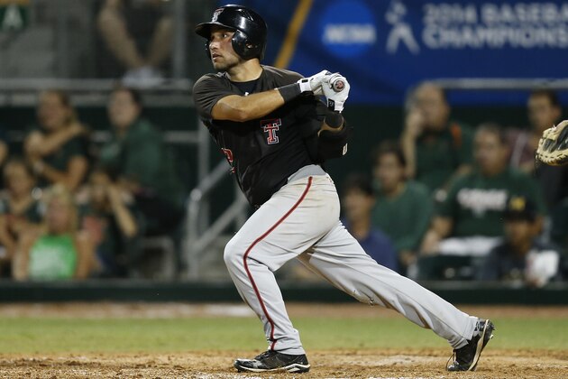 CORAL GABLES, FL - MAY 31: Eric Gutierrez #12 of the Texas Tech Red Raiders hits a single scoring a run against the Miami Hurricanes in the eighth inning during the Coral Gables Regional at the NCAA Baseball Tournament on May 31, 2014 at Alex Rodriguez Park at Mark Light Field in Coral Gables, Florida. Texas Tech defeated Miami 3-0. (Photo by Joel Auerbach/Getty Images)