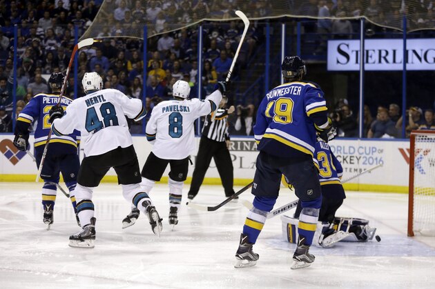 San Jose Sharks center Joe Pavelski (8) celebrates after scoring a goal during the third period in Game 5 of the NHL hockey Stanley Cup Western Conference finals against the St. Louis Blues, Monday, May 23, 2016, in St. Louis. (AP Photo/Jeff Roberson)