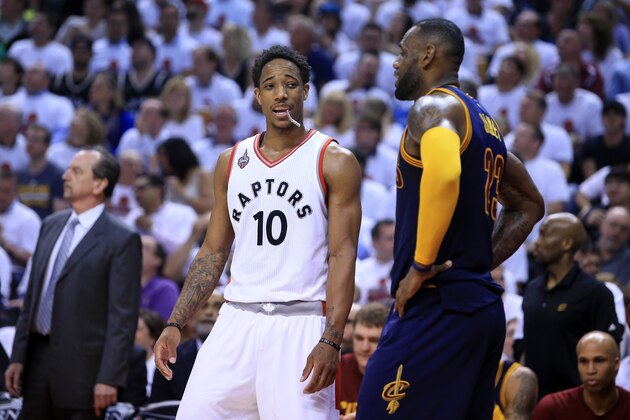 TORONTO, ON - MAY 23:  DeMar DeRozan #10 of the Toronto Raptors speaks in the third quarter to LeBron James #23 of the Cleveland Cavaliers in game four of the Eastern Conference Finals during the 2016 NBA Playoffs at the Air Canada Centre on May 23, 2016 in Toronto, Ontario, Canada. NOTE TO USER: User expressly acknowledges and agrees that, by downloading and or using this photograph, User is consenting to the terms and conditions of the Getty Images License Agreement.  (Photo by Vaughn Ridley/Getty Images)