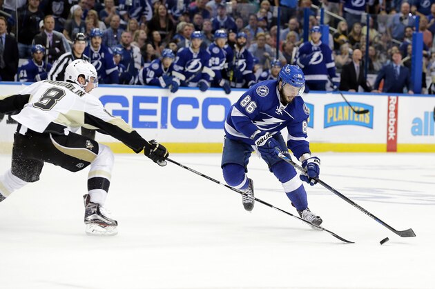 Tampa Bay Lightning's Nikita Kucherov (86), of Russia, moves the puck past Pittsburgh Penguins' Brian Dumoulin (8) during the second period of Game 4 of the NHL hockey Stanley Cup Eastern Conference finals Friday, May 20, 2016, in Tampa, Fla. (AP Photo/Chris O'Meara)