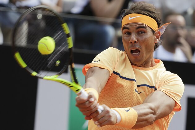 Rafael Nadal of Spain returns the ball to Nick Kyrgios of Australia during their match at the Italian Open tennis tournament, in Rome, Thursday, May 12, 2016. (AP Photo/Andrew Medichini)