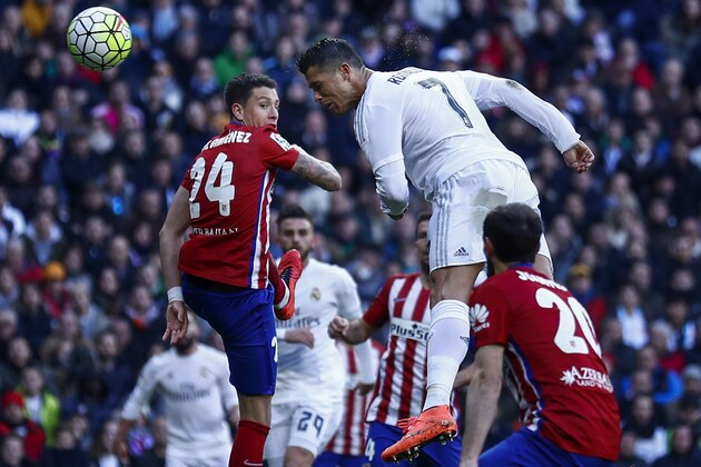 MADRID, SPAIN - FEBRUARY 27: Cristiano Ronaldo (R) of Real Madrid CF tries to score from a header during the La Liga match between Real Madrid CF and Club Atletico de Madrid at Estadio Santiago Bernabeu on February 27, 2016 in Madrid, Spain.  (Photo by Gonzalo Arroyo Moreno/Getty Images)