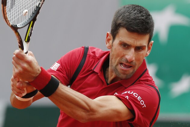 Serbia's Novak Djokovic returns in his first round match of the French Open tennis tournament against Yen-Hsun Lu of Taiwan at the Roland Garros stadium in Paris, France, Tuesday, May 24, 2016. (AP Photo/Michel Euler)