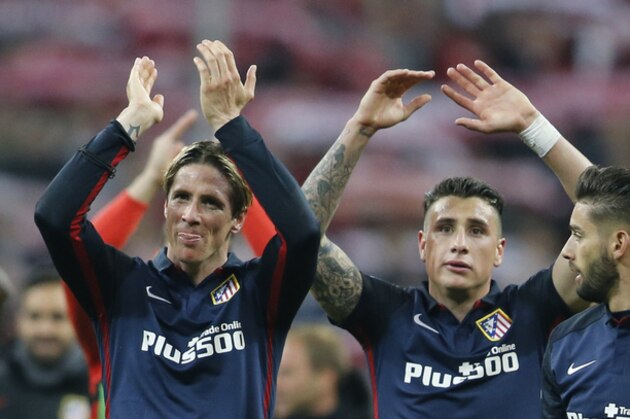 Atletico's Fernando Torres, left, celebrates with teammates Jose Maria Gimenez and Yannick Carrasco, right, after advancing to the final after the final whistle of  the Champions League second leg semifinal soccer match between Bayern Munich and Atletico de Madrid in Munich, Germany, Tuesday, May 3, 2016. (AP Photo/Michael Probst)