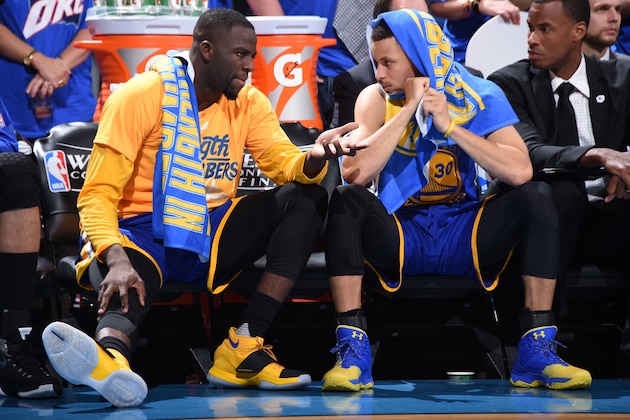OKLAHOMA CITY, OK - MAY 22:  Draymond Green #23 of the Golden State Warriors talks with Stephen Curry #30 of the Golden State Warriors on the bench during the game against the Oklahoma City Thunder in Game Three of the Western Conference Finals during the 2016 NBA Playoffs on May 22, 2016 at Chesapeake Energy Arena in Oklahoma City, Oklahoma. NOTE TO USER: User expressly acknowledges and agrees that, by downloading and or using this photograph, User is consenting to the terms and conditions of the Getty Images License Agreement. Mandatory Copyright Notice: Copyright 2016 NBAE (Photo by Andrew D. Bernstein/NBAE via Getty Images)