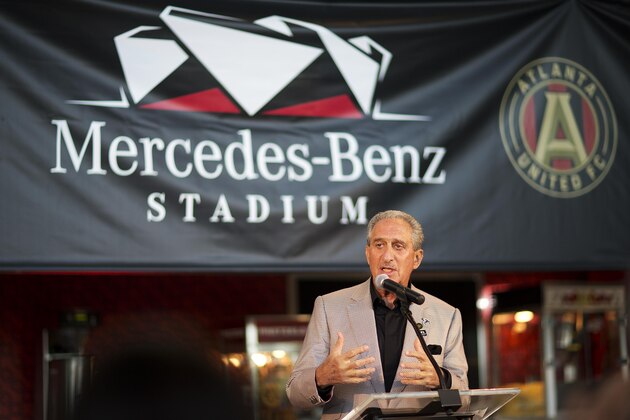 Atlanta Falcons owner Arthur Blank speaks during a news conference inside the team's new stadium currently under construction Monday, May 16, 2016, in Atlanta. Blank says the Mercedes-Benz Stadium is on schedule to open in June, 2017 as scheduled and he's hoping it will be announced next week as the site of a Super Bowl. The Falcons also unveiled their new food and beverage plan which includes $2 hot dogs and soft drinks, a sharp decrease from current prices at the Georgia Dome. (AP Photo/David Goldman)