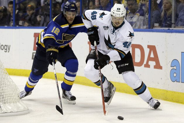 San Jose Sharks center Tomas Hertl (48) chases the puck against St. Louis Blues center Jori Lehtera (12) during the third period in Game 5 of the NHL hockey Stanley Cup Western Conference finals, Monday, May 23, 2016, in St. Louis. (AP Photo/Jeff Roberson)