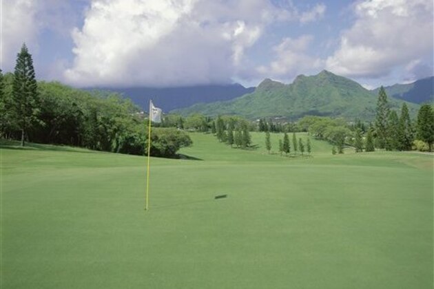 Hawaii, Oahu, Mid-Pacific Country Club Green Foreground Landscape Grounds Mountains Background Blue Sky Large White Puffy Clouds (Design Pics via AP)