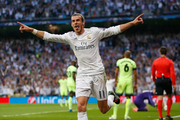 Real Madrid's Gareth Bale celebrates after scoring the opening goal during the Champions League semifinal second leg soccer match between Real Madrid and Manchester City at the Santiago Bernabeu stadium in Madrid, Wednesday May 4, 2016. (AP Photo/Francisco Seco)