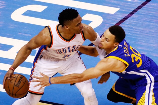 OKLAHOMA CITY, OK - MAY 24:  Russell Westbrook #0 of the Oklahoma City Thunder drives against Stephen Curry #30 of the Golden State Warriors in the second half in game four of the Western Conference Finals during the 2016 NBA Playoffs at Chesapeake Energy Arena on May 24, 2016 in Oklahoma City, Oklahoma. NOTE TO USER: User expressly acknowledges and agrees that, by downloading and or using this photograph, User is consenting to the terms and conditions of the Getty Images License Agreement.  (Photo by J Pat Carter/Getty Images)