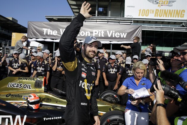 James Hinchcliffe, of Canada, celebrates winning the pole during qualifications for the Indianapolis 500 auto race at Indianapolis Motor Speedway in Indianapolis, Sunday, May 22, 2016. (AP Photo/Michael Conroy)