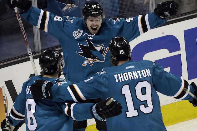 San Jose Sharks' Tomas Hertl (48) celebrates his goal with teammates Joe Thornton (19) and Joe Pavelski (8) during the third period in Game 3 of the NHL hockey Stanley Cup Western Conference finals against the St. Louis Blues on Thursday, May 19, 2016, in San Jose, Calif. San Jose won 3-0. (AP Photo/Marcio Jose Sanchez)