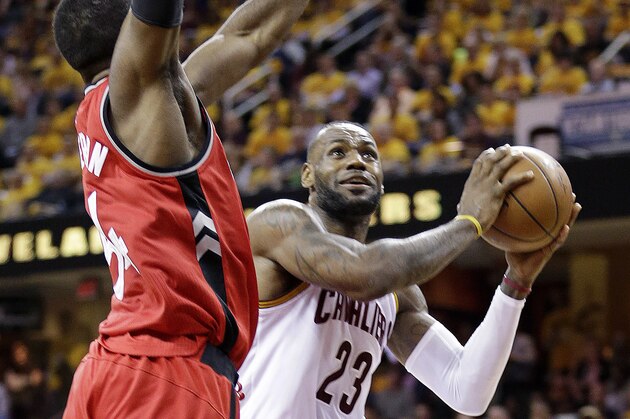 Cleveland Cavaliers' LeBron James (23) goes up for a shot against Toronto Raptors' Patrick Patterson (54) during the second half of Game 2 of the NBA basketball Eastern Conference finals Thursday, May 19, 2016, in Cleveland. (AP Photo/Tony Dejak)