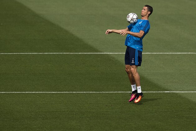 Real Madrid Cristiano Ronaldo plays with a ball during a training session ahead of Saturday's Champions League soccer match final between Atletico de Madrid and Real Madrid, at the Valdebebas stadium in Madrid, Spain, Tuesday, May 24, 2016 . (AP Photo/Daniel Ochoa de Olza)