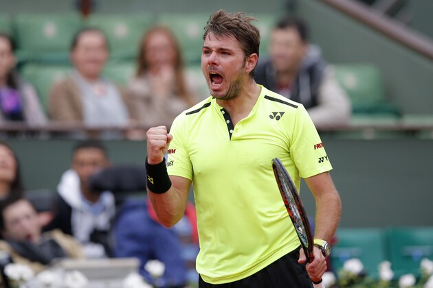 Defending champion Switzerland's Stan Wawrinka celebrates a winning point as he plays Czech Republic's Lukas Rosol during their first round match of the French Open tennis tournament at the Roland Garros stadium, Monday, May 23, 2016 in Paris.  (AP Photo/Christophe Ena)