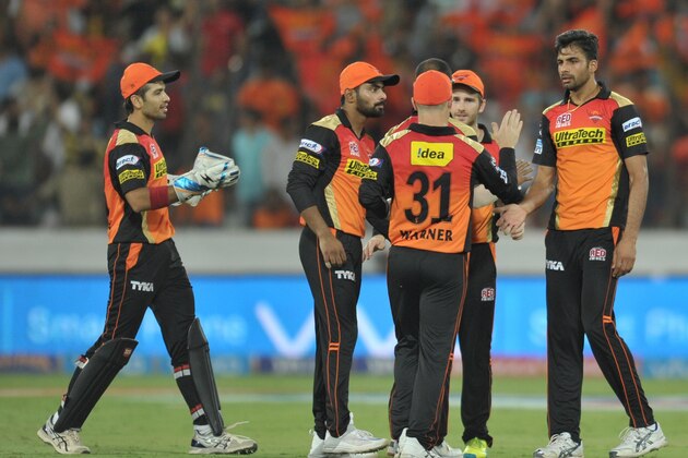 Sunrisers Hyderabad team celebrates the wicket of Royal Challengers Bangalore AB de Villiers during the 2016 Indian Premier League (IPL) Twenty20 cricket match between Sunrisers Hyderabad and Royal Challengers Bangalore at The Rajiv Gandhi International Stadium in Hyderabad  on April 30, 2016. / AFP / NOAH SEELAM        (Photo credit should read NOAH SEELAM/AFP/Getty Images)