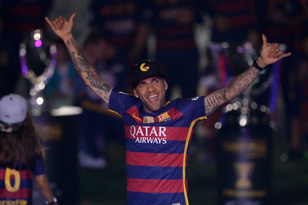 Barcelona's Brazilian defender Dani Alves acknowledges the crowd during celebrations at the Camp Nou stadium in Barcelona on May 23, 2016 following their Spanish 'Copa del Rey' (King's Cup) final football match 2-0 victory over Sevilla FC yesterday also marking the club's 28th Copa del Rey win and the 24th Spanish Liga title. / AFP / JOSEP LAGO        (Photo credit should read JOSEP LAGO/AFP/Getty Images)