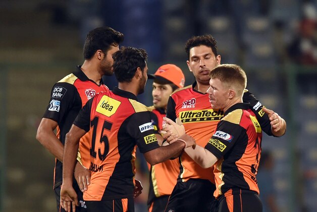 Sunrisers Hyderabad captain David Warner (R) celebrates the victory over Kolkata Knight Riders with teammates  during the 2016 Indian Premier League (IPL) Twenty20 eliminator cricket match between Kolkata Knight Riders and Sunrisers Hyderabad at the Feroz Shah Kotla Cricket Stadium in New Delhi on May 25, 2016. / AFP / PRAKASH SINGH        (Photo credit should read PRAKASH SINGH/AFP/Getty Images)