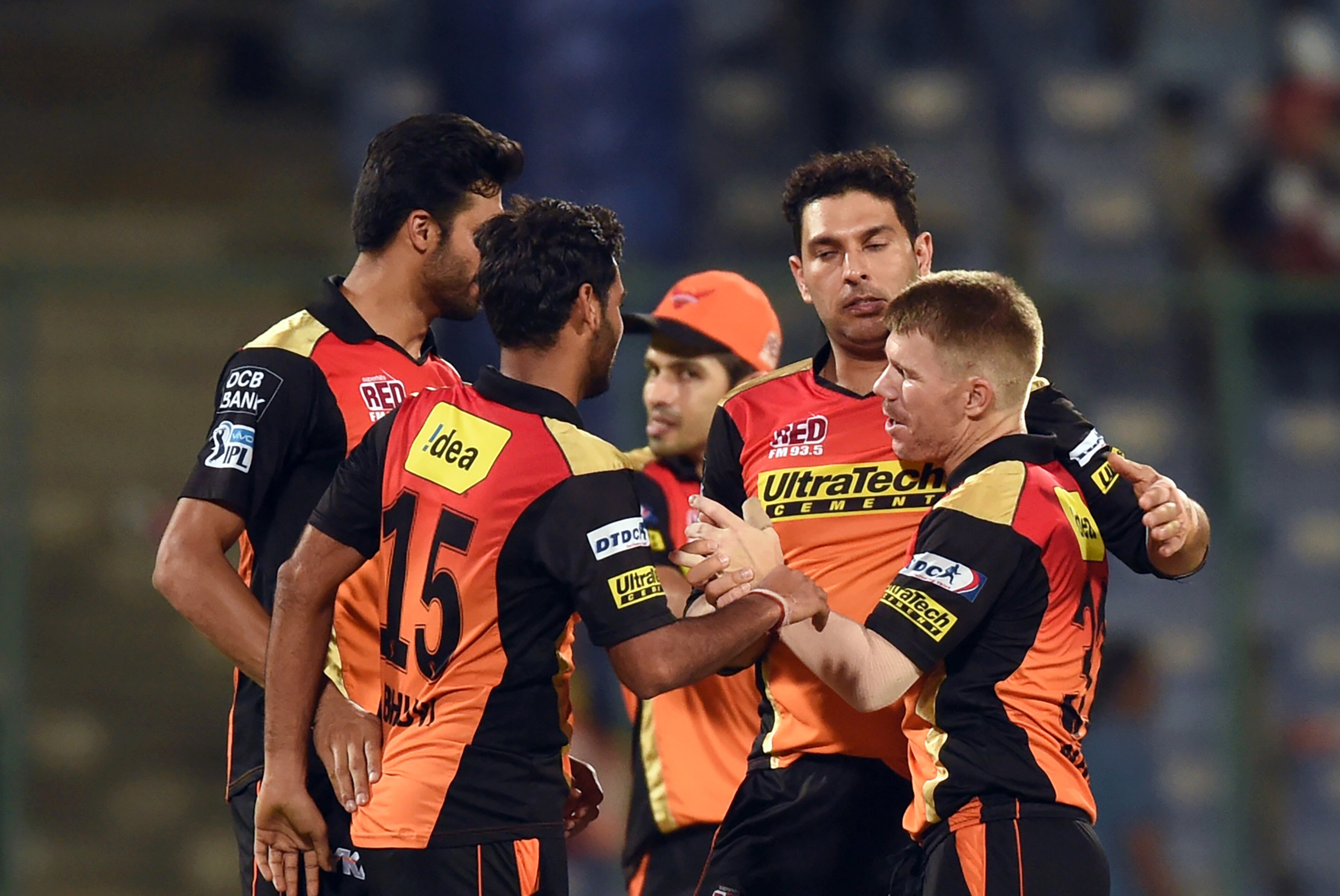Sunrisers Hyderabad captain David Warner (R) celebrates the victory over Kolkata Knight Riders with teammates  during the 2016 Indian Premier League (IPL) Twenty20 eliminator cricket match between Kolkata Knight Riders and Sunrisers Hyderabad at the Feroz Shah Kotla Cricket Stadium in New Delhi on May 25, 2016. / AFP / PRAKASH SINGH        (Photo credit should read PRAKASH SINGH/AFP/Getty Images)