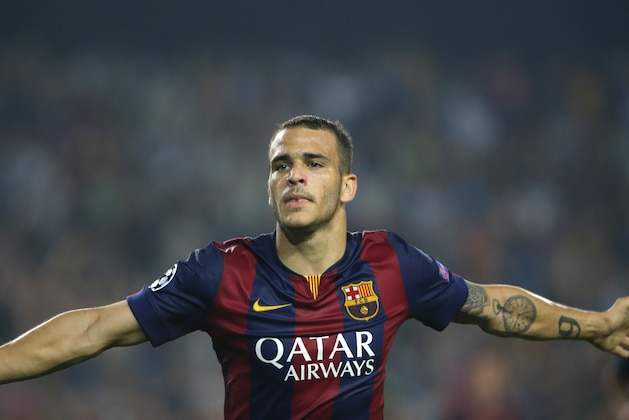 Barcelona's Sandro Ramirez celebrates after scoring his side's 3rd goal during the Champions League group F soccer match between F.C. Barcelona and Ajax at Camp Nou stadium in Barcelona, Spain, Tuesday, Oct. 21, 2014. (AP Photo/Emilio Morenatti)