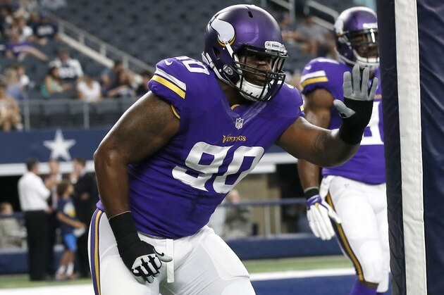 Minnesota Vikings defensive end B.J. Dubose (90) runs drills during warm ups before a preseason NFL football game against the Dallas Cowboys Saturday, Aug. 29, 2015, in Arlington, Texas.  (AP Photo/Tony Gutierrez)
