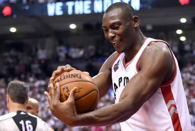 May 23, 2016; Toronto, Ontario, CAN; Toronto Raptors center Bismack Biyombo (8) smiles as he holds the ball at the end of a 105-99 win over Cleveland Cavaliers in game four of the Eastern conference finals of the NBA Playoffs at Air Canada Centre. Mandatory Credit: Dan Hamilton-USA TODAY Sports May 23, 2016; Toronto, Ontario, CAN; Toronto Raptors center Bismack Biyombo (8) smiles as he holds the ball at the end of a 105-99 win over Cleveland Cavaliers in game four of the Eastern conference finals of the NBA Playoffs at Air Canada Centre. Mandatory Credit: Dan Hamilton-USA TODAY Sports