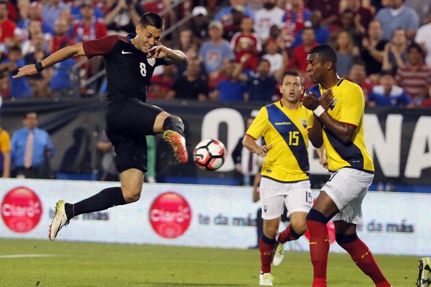 U.S. forward Clint Dempsey (8) takes a shot as Ecuador's Pedro Larrea (15) and Frickson Erazo, right, defend in the second half of an exhibition soccer match, Wednesday, May 25, 2016, in Frisco, Texas. The United States won 1-0. (AP Photo/Tony Gutierrez)