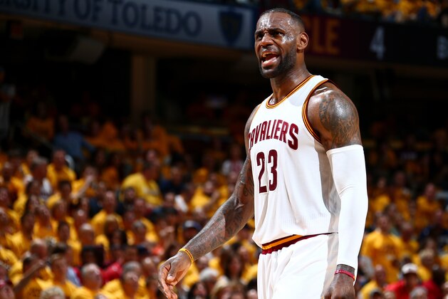 CLEVELAND, OH - MAY 25:  LeBron James #23 reacts during Game Five of the Eastern Conference Finals during the 2016 NBA Playoffs between the Toronto Raptors and the Cleveland Cavaliers on May 25, 2016 at Quicken Loans Arena in Cleveland, OH. NOTE TO USER: User expressly acknowledges and agrees that, by downloading and/or using this Photograph, user is consenting to the terms and conditions of the Getty Images License Agreement. Mandatory Copyright Notice: Copyright 2016 NBAE (Photo by Nathaniel S. Butler/NBAE via Getty Images)