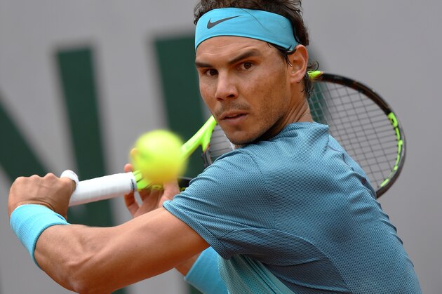 Spain's Rafael Nadal returns the ball to Australia's Samuel Groth during their men's first round match at the Roland Garros 2016 French Tennis Open in Paris on May 24, 2016. / AFP / MIGUEL MEDINA (Photo credit should read MIGUEL MEDINA/AFP/Getty Images) Spain's Rafael Nadal returns the ball to Australia's Samuel Groth during their men's first round match at the Roland Garros 2016 French Tennis Open in Paris on May 24, 2016. / AFP / MIGUEL MEDINA (Photo credit should read MIGUEL MEDINA/AFP/Getty Images)