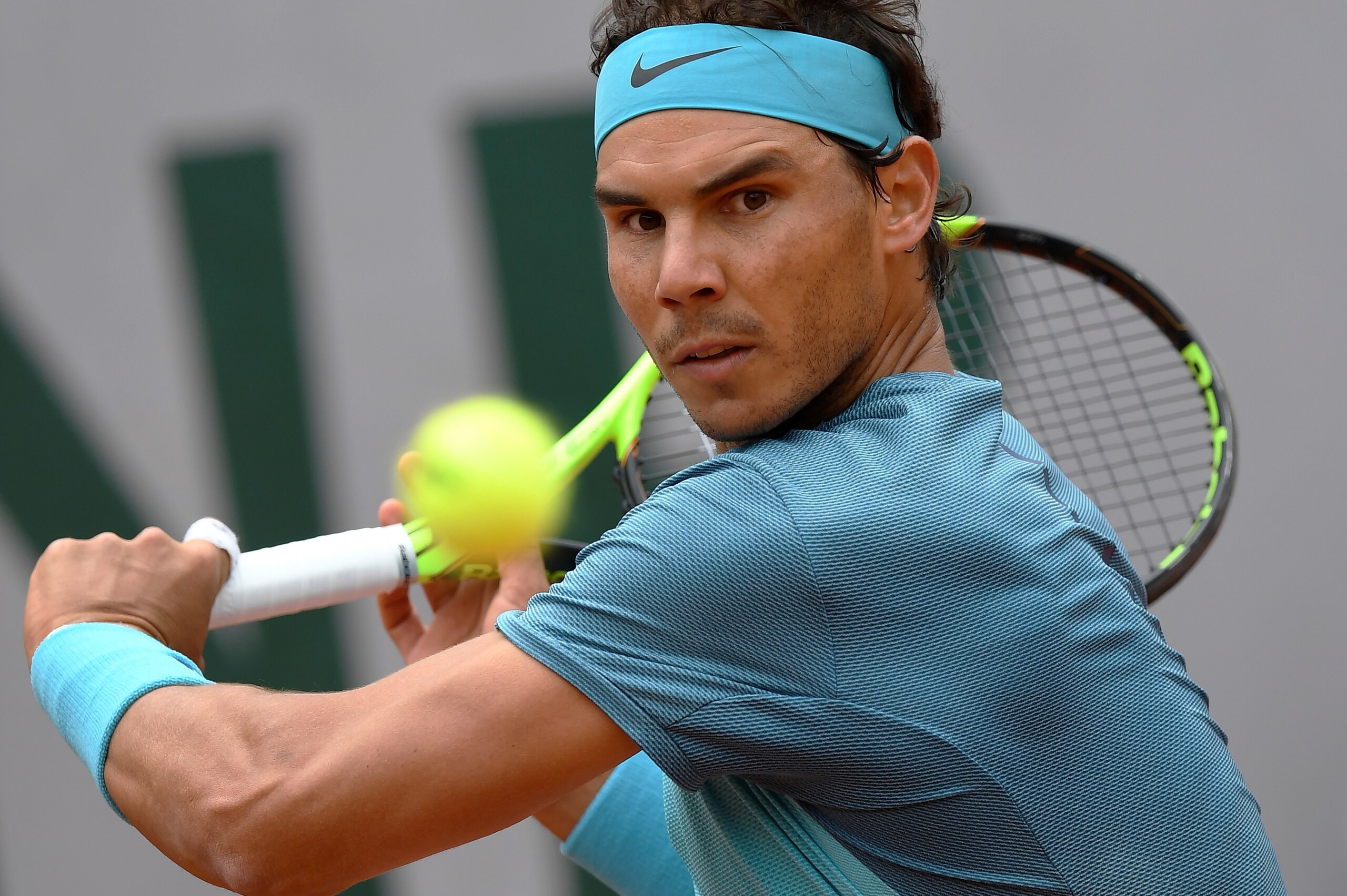 Spain's Rafael Nadal returns the ball to Australia's Samuel Groth during their men's first round match at the Roland Garros 2016 French Tennis Open in Paris on May 24, 2016. / AFP / MIGUEL MEDINA        (Photo credit should read MIGUEL MEDINA/AFP/Getty Images)