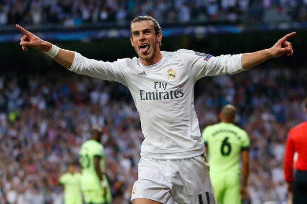 Real Madrid's Gareth Bale celebrates after scoring the opening goal during the Champions League semifinal second leg soccer match between Real Madrid and Manchester City at the Santiago Bernabeu stadium in Madrid, Wednesday May 4, 2016. (AP Photo/Francisco Seco)