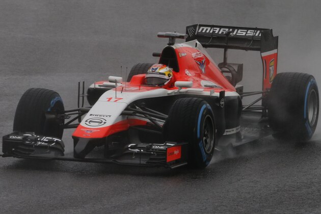 Marussia driver Jules Bianchi of France steers his car during the Japanese Formula One Grand Prix at the Suzuka Circuit in Suzuka, central Japan, Sunday, Oct. 5, 2014. Bianchi has been taken to hospital and is unconscious following a crash during the Japanese Grand Prix. (AP Photo/Shuji Kajiyama)