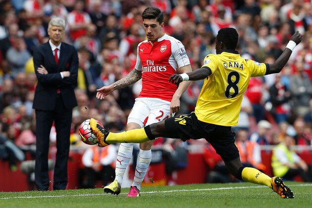 Arsenal's French manager Arsene Wenger (L) watches as Arsenal's Spanish defender Hector Bellerin (C) vies with Aston Villa's Senegalese midfielder Idrissa Gueye during the English Premier League football match between Arsenal and Aston Villa at the Emirates Stadium in London on May 15, 2016.  / AFP / Ian Kington / RESTRICTED TO EDITORIAL USE. No use with unauthorized audio, video, data, fixture lists, club/league logos or 'live' services. Online in-match use limited to 75 images, no video emulation. No use in betting, games or single club/league/player publications.  /         (Photo credit should read IAN KINGTON/AFP/Getty Images)