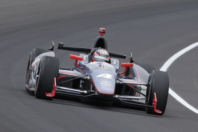 JR Hildebrand drives through the first turn during practice for the Indianapolis 500 auto race at the Indianapolis Motor Speedway in Indianapolis, Friday, May 17, 2013. (AP Photo/AJ Mast)