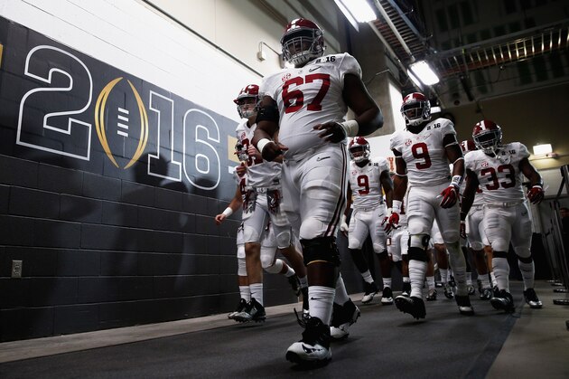 GLENDALE, AZ - JANUARY 11:  Josh Casher #67 of the Alabama Crimson Tide leads the team back to the field before the start of the second half in the 2016 College Football Playoff National Championship Game against the Clemson Tigers at University of Phoenix Stadium on January 11, 2016 in Glendale, Arizona.  (Photo by Christian Petersen/Getty Images)