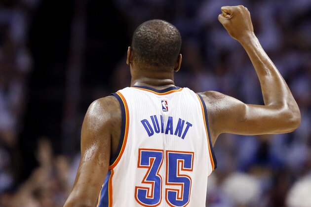 Oklahoma City Thunder forward Kevin Durant (35) raises a fist in celebration against the Golden State Warriors during the first half in Game 4 of the NBA basketball Western Conference finals in Oklahoma City, Tuesday, May 24, 2016. (AP Photo/Sue Ogrocki)