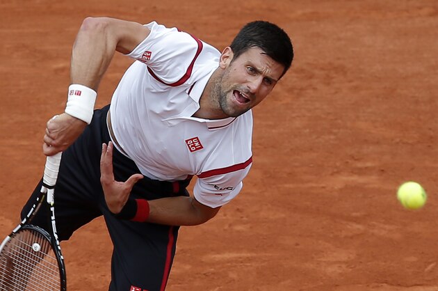 Serbia's Novak Djokovic serves the ball to Belgium’s Steve Darcis during their second round match of the French Open tennis tournament at the Roland Garros stadium, Thursday, May 26, 2016 in Paris.  (AP Photo/Michel Euler)