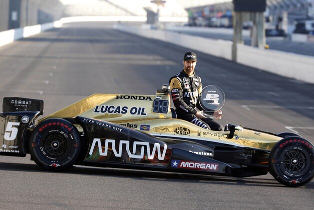 May 23, 2016; Indianapolis, IN, USA; Verizon Indy Car driver James Hinchcliffe poses for a photo after winning the pole before practice starts for the Indianapolis 500 at Indianapolis Motor Speedway. Mandatory Credit: Brian Spurlock-USA TODAY Sports