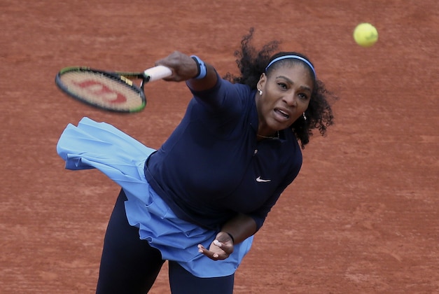Serena Williams of the U.S. serves the ball to Slovakia's Magdalena Rybarikova during their first round of the French Open tennis tournament at the Roland Garros stadium, Tuesday, May 24, 2016 in Paris.  (AP Photo/David Vincent)