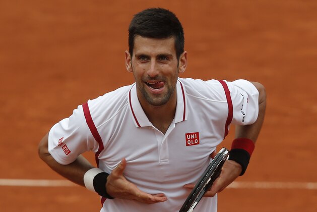 Serbia's Novak Djokovic cheers the audience after defeating Belgium’s Steve Darcis during their second round match of the French Open tennis tournament at the Roland Garros stadium, Thursday, May 26, 2016 in Paris. Djokovic won 7-5, 6-3, 6-4. (AP Photo/Michel Euler)