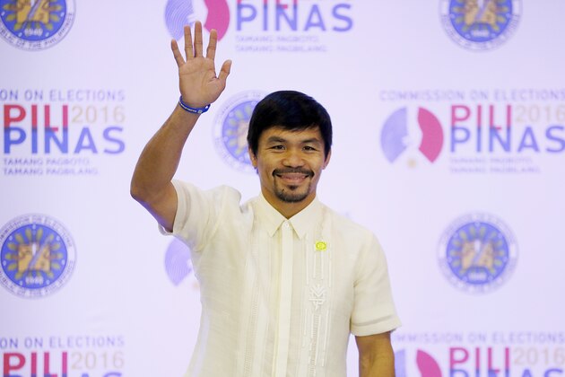 Filipino boxing great and now Senator Manny Pacquiao waves following his proclamation as the Seventh Senator in ceremony at the Commission on Elections Thursday, May 19, 2016 in suburban Pasay city south of Manila, Philippines. Pacquiao has won a seat in the Philippine Senate based on an unofficial count bringing him closer to a possible crack at the presidency. Pacquiao said he will retire from boxing to become a full-time politician. (AP Photo/Bullit Marquez)