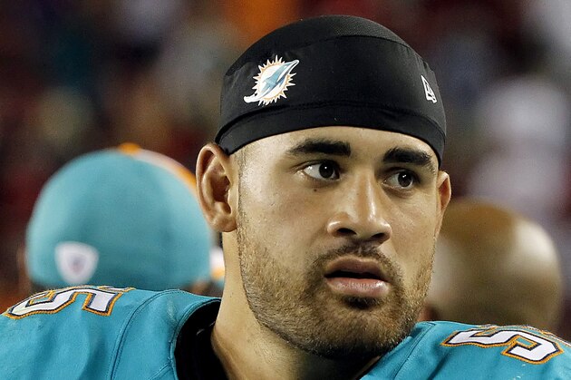 Aug 16, 2014; Tampa, FL, USA; Miami Dolphins outside linebacker Koa Misi (55) against the Tampa Bay Buccaneers during the second half at Raymond James Stadium. Miami Dolphins defeated the Tampa Bay Buccaneers 20-14. Mandatory Credit: Kim Klement-USA TODAY Sports