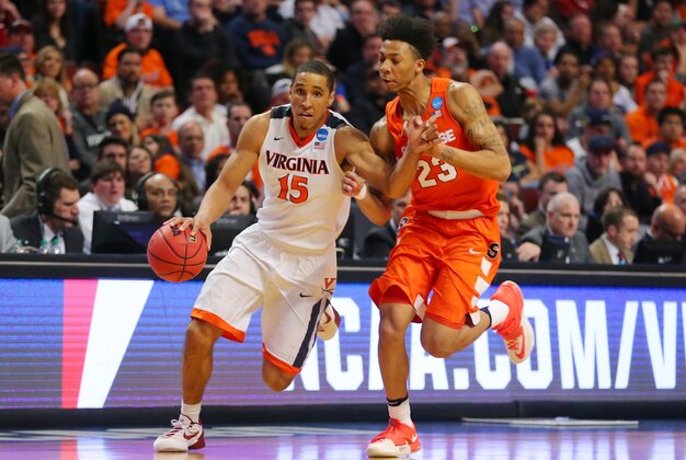 Mar 27, 2016; Chicago, IL, USA; Virginia Cavaliers guard Malcolm Brogdon (15) is defended by Syracuse Orange guard Malachi Richardson (23) during the second half in the championship game of the midwest regional of the NCAA Tournament at the United Center. Mandatory Credit: Dennis Wierzbicki-USA TODAY Sports