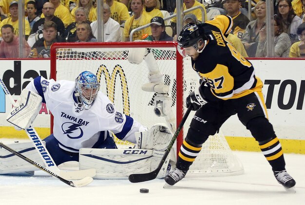 May 22, 2016; Pittsburgh, PA, USA; Tampa Bay Lightning goalie Andrei Vasilevskiy (88) makes a save against Pittsburgh Penguins center Sidney Crosby (87) during the first period in game five of the Eastern Conference Final of the 2016 Stanley Cup Playoffs at the CONSOL Energy Center. Mandatory Credit: Charles LeClaire-USA TODAY Sports