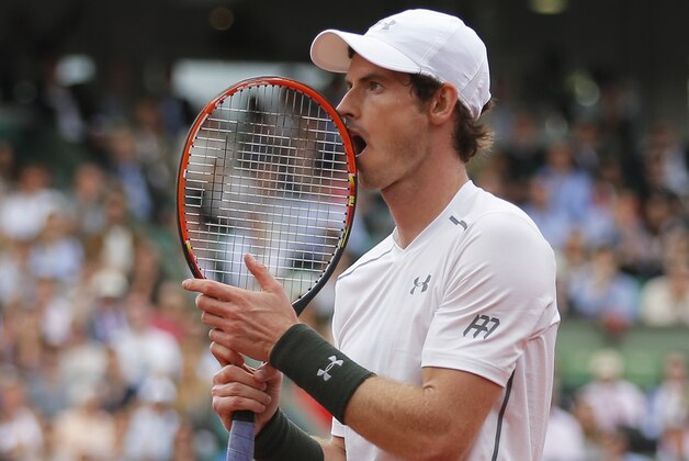 Britain's Andy Murray puts his racket against his mouth in his second round match of the French Open tennis tournament against France’s Mathias Bourgue at the Roland Garros stadium in Paris, France, Wednesday, May 25, 2016. (AP Photo/Christophe Ena)