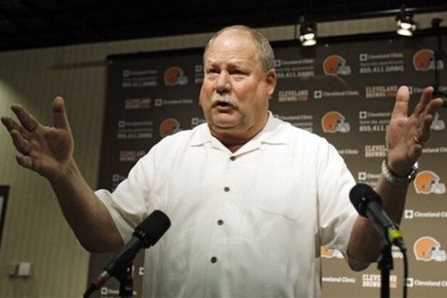 Former Cleveland Browns president Mike Holmgren gestures while answering questions during a news conference Monday, Nov. 26, 2012, in Berea, Ohio. Holmgren is leaving the team immediately rather than stay on as an adviser through the end of this season. His exit raises more questions about a possible return to coaching and what he truly accomplished during his time with Cleveland. (AP Photo/Tony Dejak)